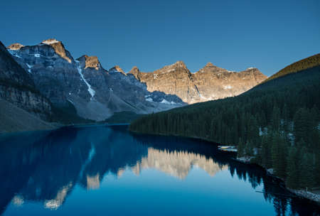 Sun rising view a top of a peak overlooking Lake Moraine in Banff National Park.の写真素材