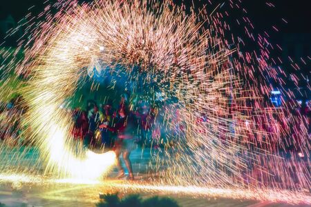 Steel Wool Fire Spinner at pyrotechnic showの写真素材
