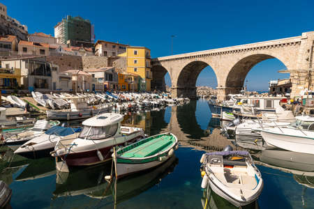 Marseille, Provence-Alpes-Cote d'Azur / France - March 31st 2019: Vallon des Auffes - Traditional mediterranean fishing haven with colorful pointu boats.のeditorial素材