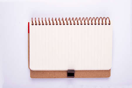 yellow leaf lined small notebook that can be carried in a pocket that is often used in daily lifeの写真素材