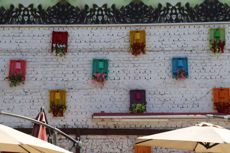 Decorative lights on a traditional brick wall painted over whiteの写真素材
