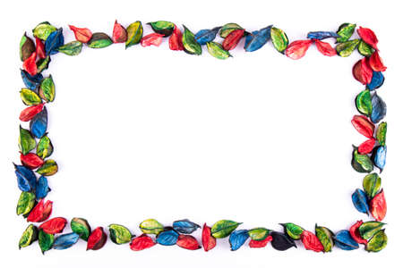 Colored frame made with colored leaves on a white background