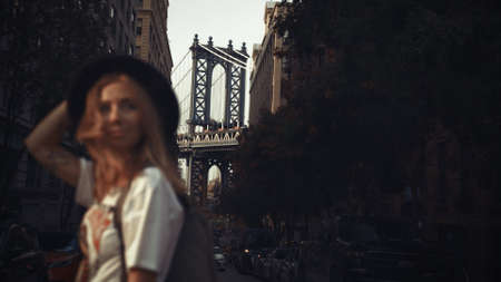 Pretty Woman at The Brooklyn Bridge in New York City at Sunriseの写真素材