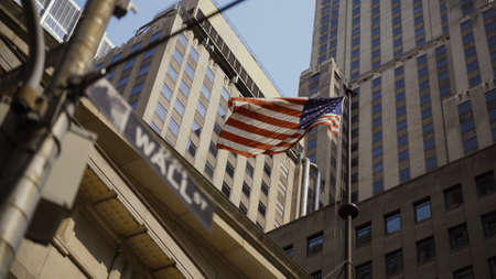 Wall Street Sign with American in Backgroundの写真素材