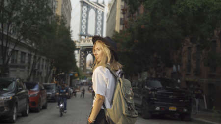 Pretty Woman at The Brooklyn Bridge in New York City at Sunriseの写真素材
