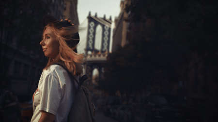 Pretty Woman at The Brooklyn Bridge in New York City at Sunriseの写真素材