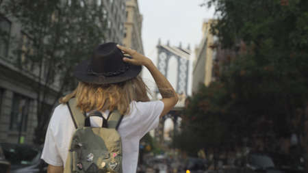 Pretty Woman at The Brooklyn Bridge in New York City at Sunriseの写真素材