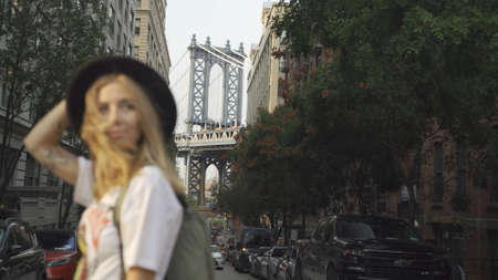 Pretty Woman at The Brooklyn Bridge in New York City at Sunrise