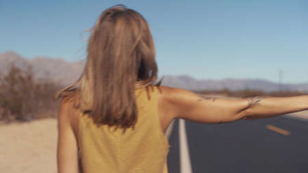 Girl Hitchhiking in Arizona, USAの写真素材
