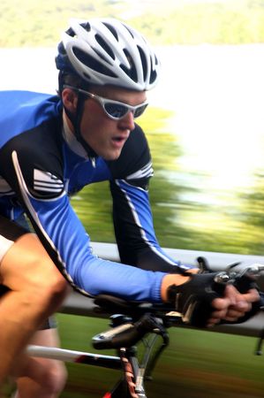 A fast image of a cyclist on a time trial/triathalon road bike