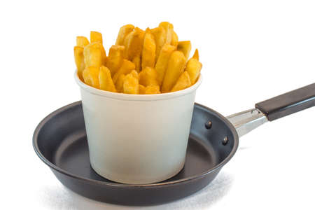 French fries in white box with ketchup on white background.の写真素材