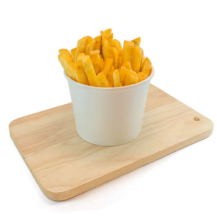 French fries in white box with ketchup on white background.の写真素材