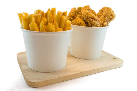 Frenchfries and nuggets in paper boxes on white backgroundの写真素材