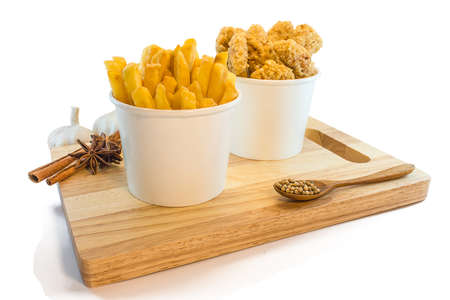 Frenchfries and nuggets in paper boxes on white backgroundの写真素材