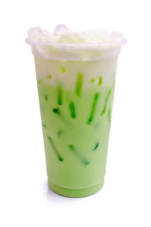 Kiwi milk from the glass on isolated white background.の写真素材