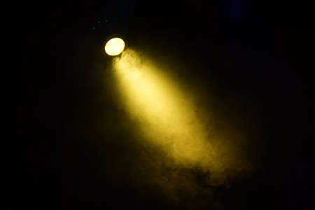 Colored lights illuminate the theatrical stage