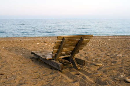 Wooden deck chair on the beach