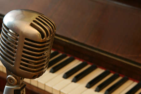 Vintage microphone and an old piano, selective focusの写真素材