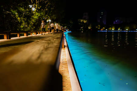 People walking beside a poolのeditorial素材