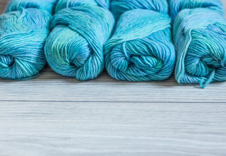 Blue yarns on a grey backgroundの写真素材