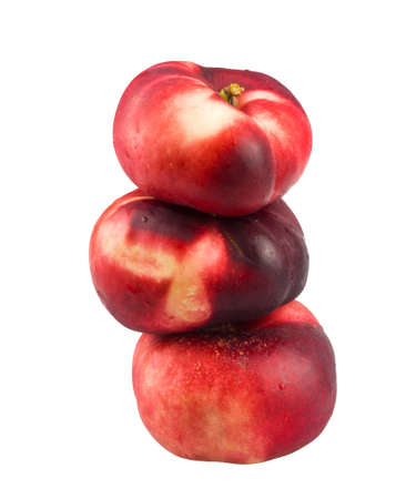 flat nectarines isolated on white backgroundの写真素材