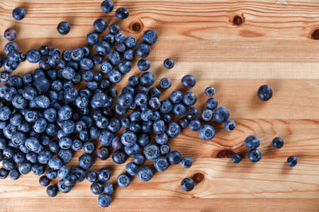 Fresh Organic Blueberries on wooden table. Background.の写真素材