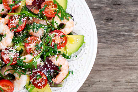 Sea Food salad with Shrimp and vegetables. on wooden table.の写真素材