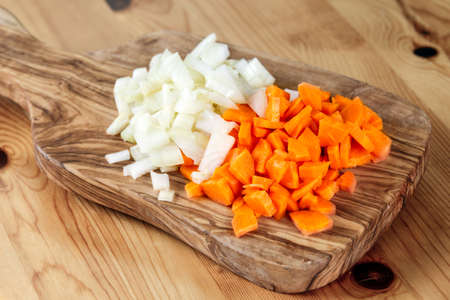 Carrot and Onion Vegetable sliced on wooden board. Background.の写真素材