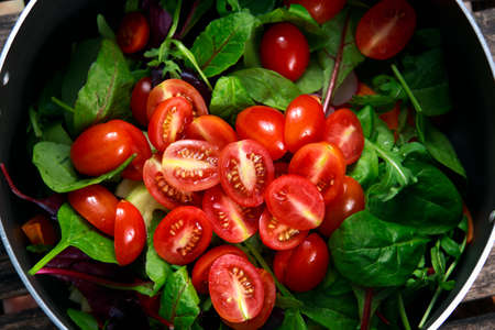 Fresh Close up Tomato cherry plumb salad in panの写真素材