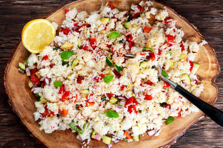 Homemade Hot Rice and vegetables, herbs on wooden board.の写真素材