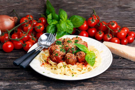 Italian Pasta spaghetti with meatballs in tomato sauce.の写真素材