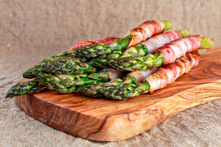 Bacon Wrapped Asparagus on wooden desk.の写真素材