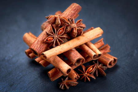 Cinnamon sticks and anice on wooden table. selected focus.の写真素材