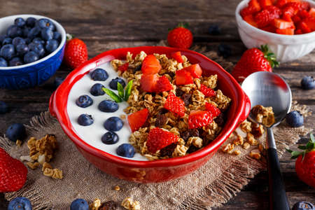 Homemade granola Breakfast with yogurt and fresh fruit berries. concepts health food.の写真素材