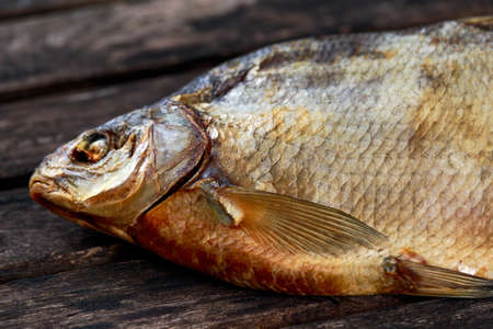 Salted Dry fish vobla on wooden table.の写真素材