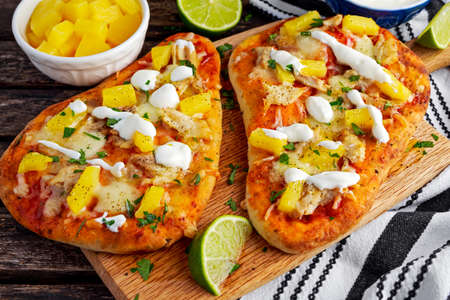 Homemade hawaii Flatbread Pizza with chicken and pineapple dressing yogurt sauce