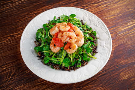 Fresh Healthy Prawns black rice salad on white plate.の写真素材