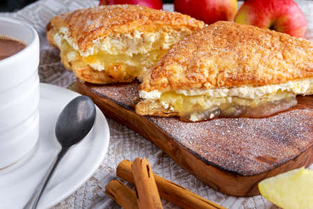 Puff pastry Turnovers apple cake dessert with whipped cream and hot coffeeの写真素材