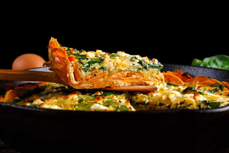 Home made Spinach quiche in a sweet potato crust with feta cheese.の写真素材