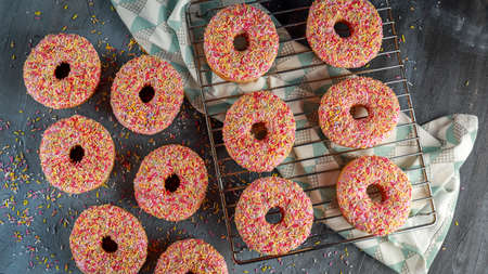 Iced doughnut rings with rainbow sparkl strandsの写真素材