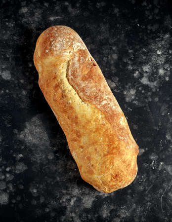 Rustic hand made italian ciabatta bread on table