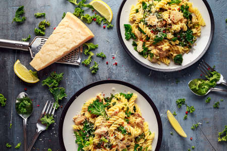 Homemade Pasta fusilli with Chicken, Green Kale, Garlic, lemon and parmesan cheese. healthy home foodの写真素材
