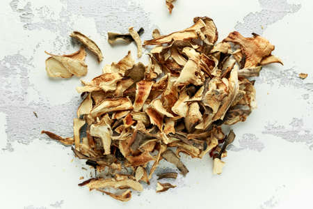 Dried porcini mushrooms on white background, texture.