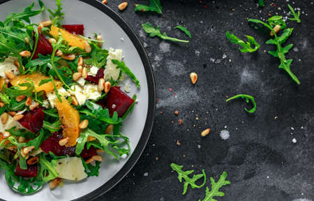 Fresh Beet, Orange salad with wild rocket, cheese and Pine nuts. healthy summer foodの写真素材