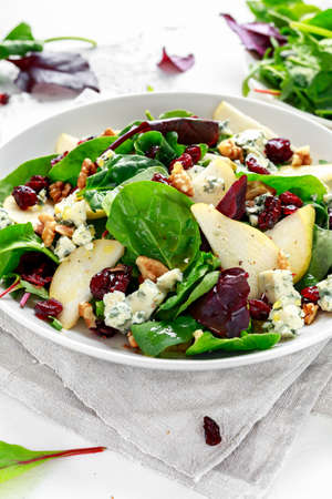Fresh Pears, Blue Cheese salad with vegetable green mix, walnuts, cranberry. healthy foodの写真素材
