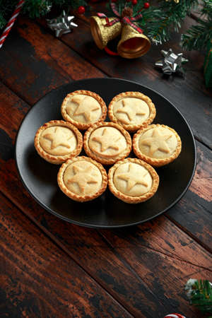 British Christmas mince pies with green christmas background