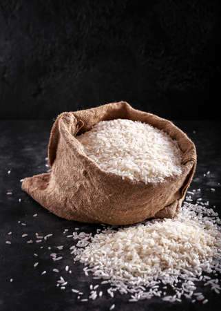 White raw basmati rice in burlap bag. space, textの写真素材