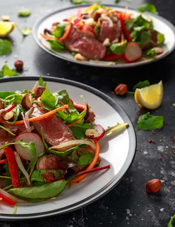Spicy Beef Salad with Carrots, radish, bean sprouts, chilli, nuts and green mixの写真素材