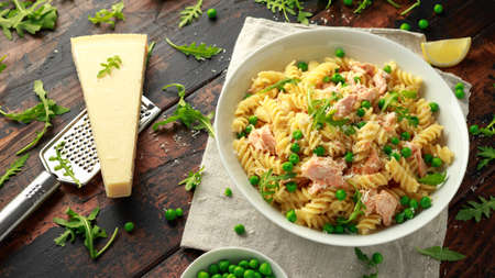 Homemade Pasta fusilli with salmon, green peas, parmesan cheese and lemon. healthy foodの写真素材