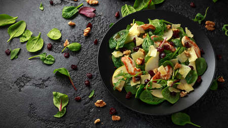 Pear, chicken salad with cheddar cheese, cranberry and walnuts. healthy food.の写真素材
